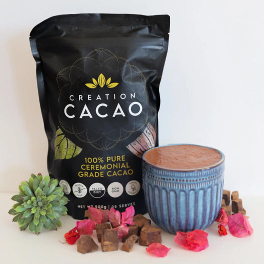 Creation Cacao 500g Drink pack with a hot chocolate in a mug