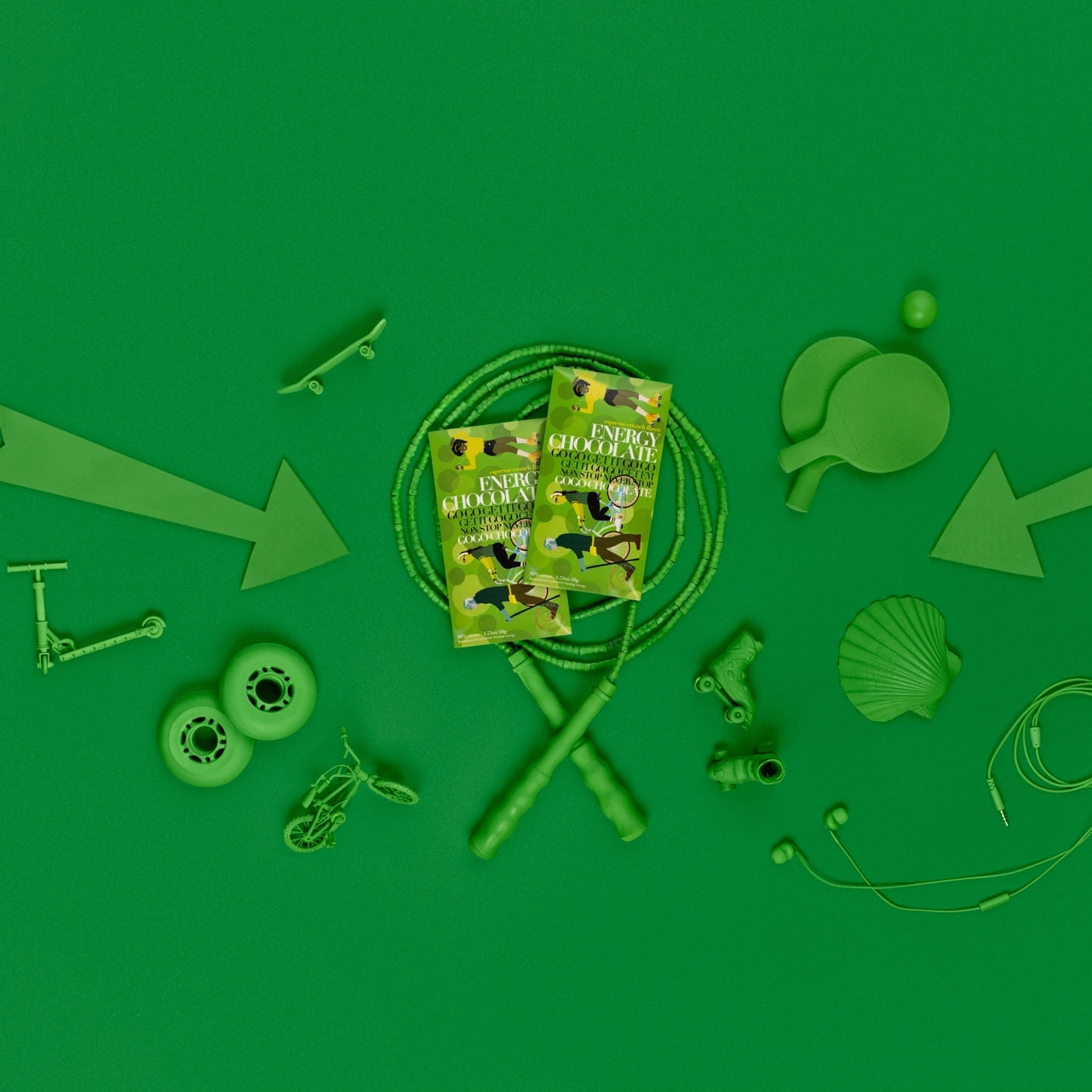 Funco energy chocolate with green objects around the product like arrows, jumprope, scooters and headphones