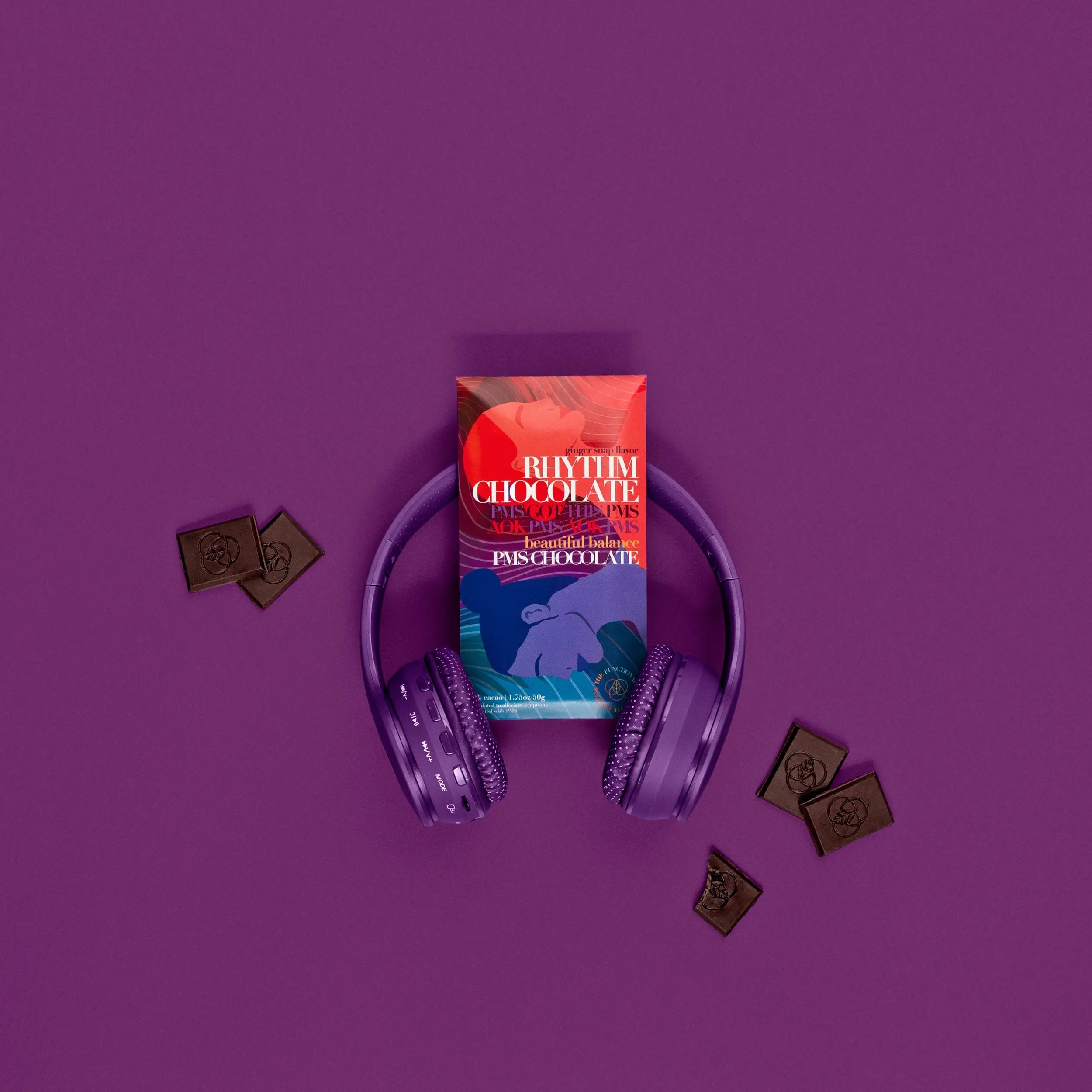 Funco rhythm chocolate product image with purple headphones and pieces of chocolate around the product